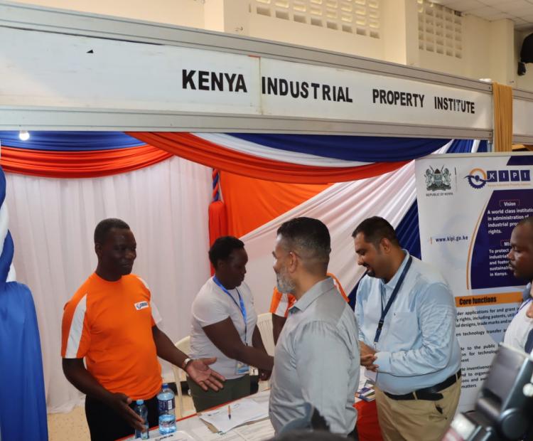 Erick Okoth (Left) of Trade Mark Division explains to H.E Abdulswamad Nasir, the Mombasa County Governor, the process and value of trade marks to manufacturers, including the micro, small and medium enterprises, during the Changamka Shopping Expo when the Governor toured the Institute's stand at the Oshwal Centre. The Expo was held from 30th November to 2nd December 2023. 